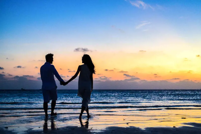 couple on beach at sunset